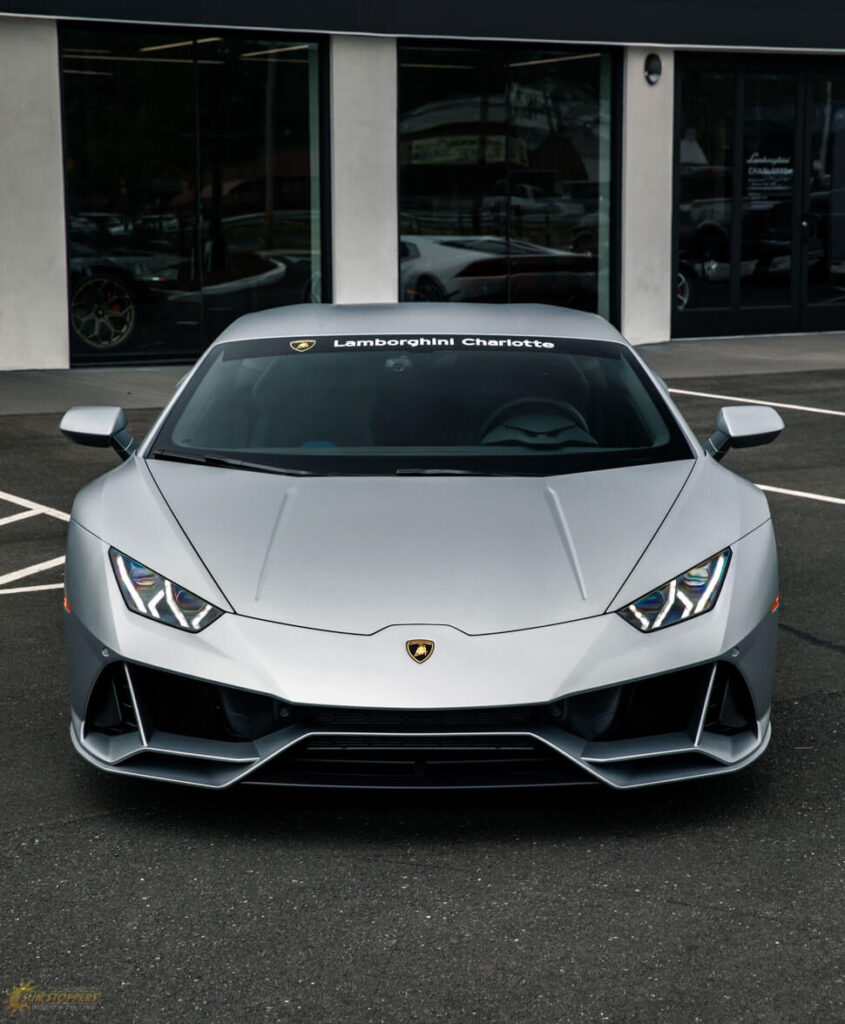 silver sports car with tinted windows