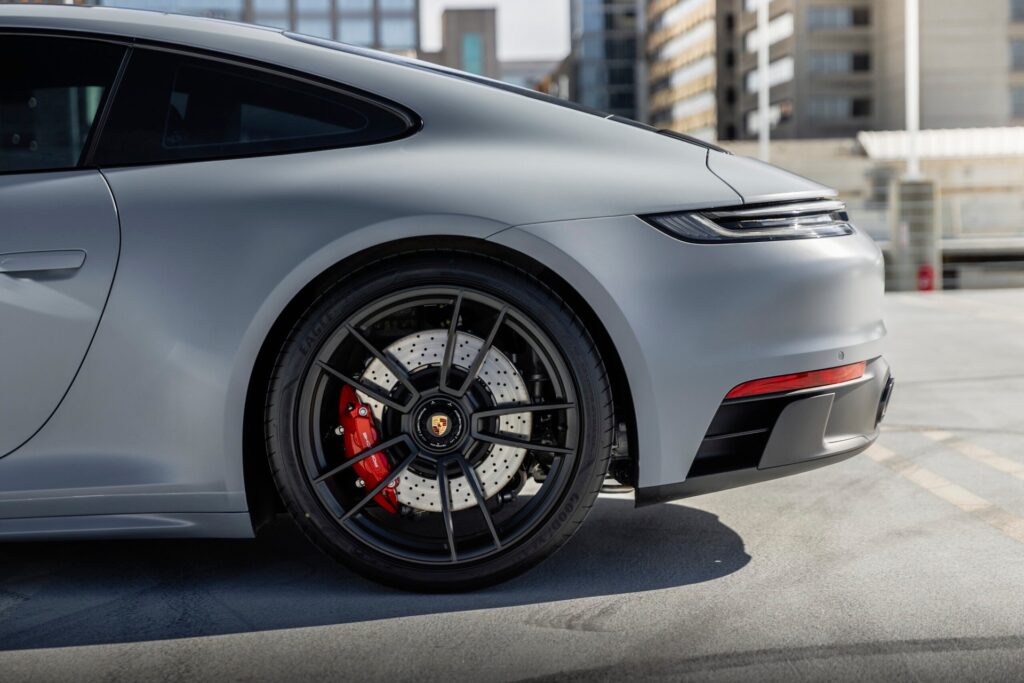 rear side view of gray porsche