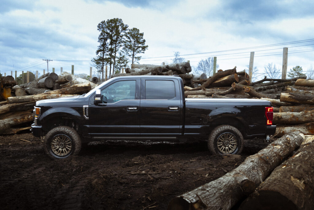 blue truck in a lumber yard
